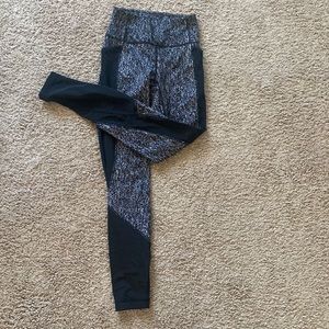 Lulu lemon black and white leggings with black mesh detailing, size 4